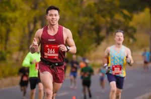 men running and smiling at the camera
