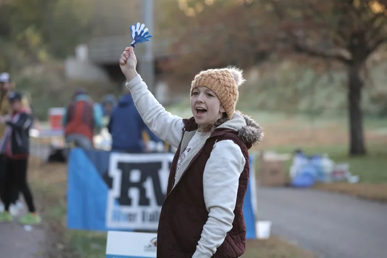 woman holding clapping hands toy